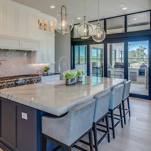 luxury white kitchen with glass light fixtures     