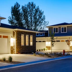 A suburban house with a garage in a neighborhood