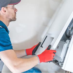 Professional checking a furnace after moving it