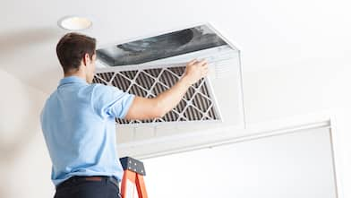 man removing air filter/ air duct