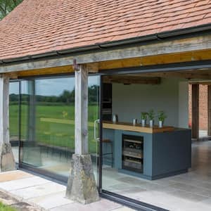 Glass sliding doors of a renovated barn home