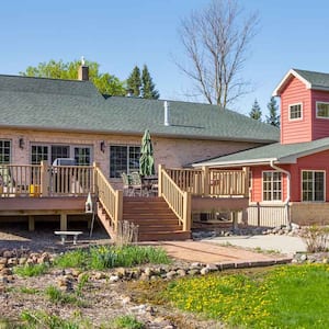  Large home with an attached wooden deck