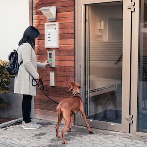 Woman opening apartment entrance door