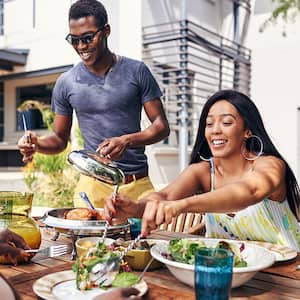 Family enjoying a meal in the backyard