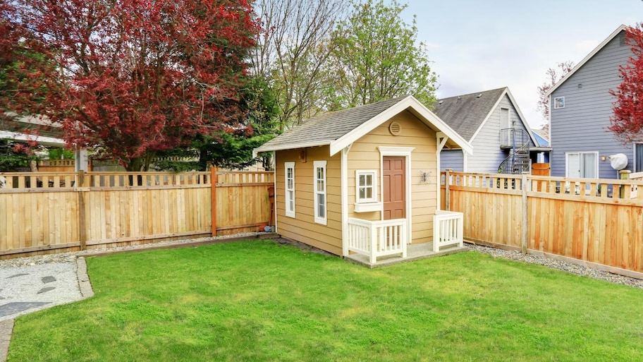 A small wooden shed in the backyard