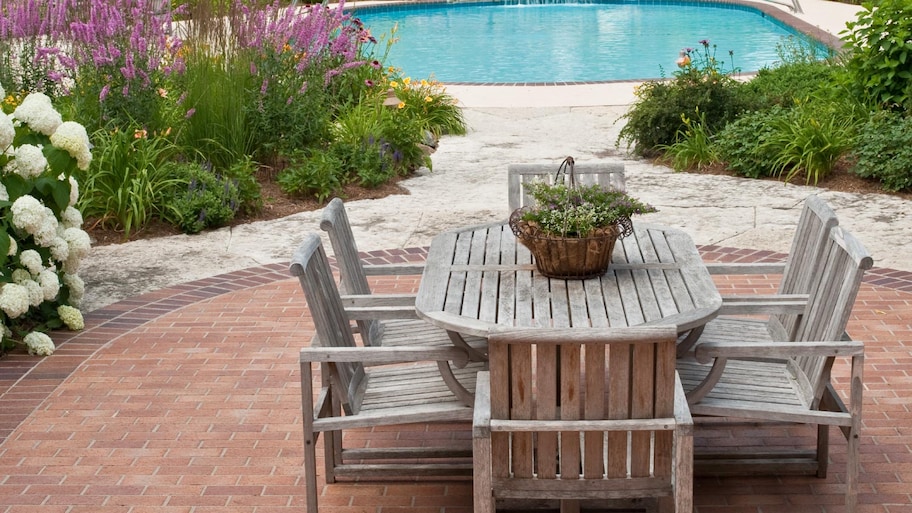 A dining area and swimming pool