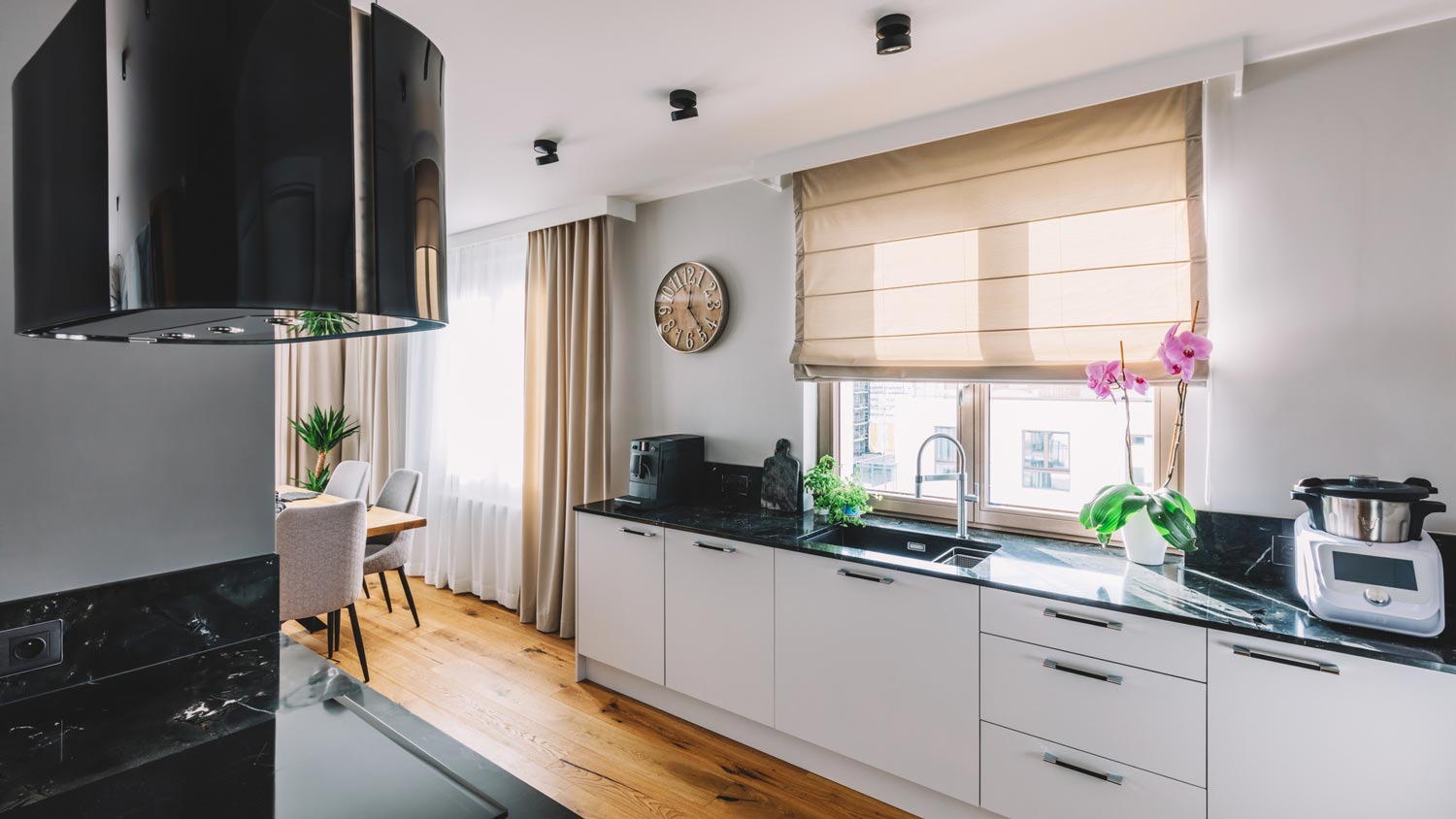 A kitchen with black quartzite countertop