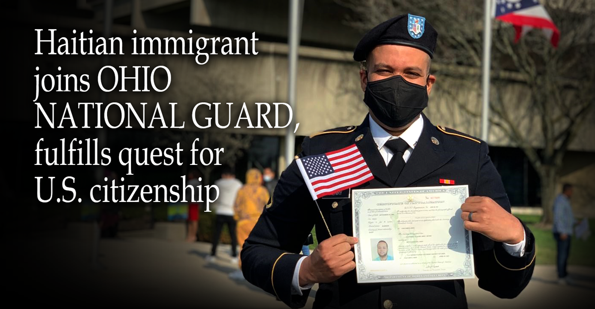 Henry in uniform holding certificate.