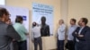 Journalists sign a banner calling to free WikiLeaks founder Julian Assange after a press conference at Geneva press club, in Geneva on June 22, 2022.