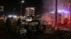 Firemen extinguish flames on the car of journalist Saber al-Haidari, who was killed by an explosive device explosion in Aden, Yemen, June 15, 2022. 