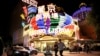 FILE - People walk in front of Casino Lisboa in Macau, China, Dec. 21, 2019. 