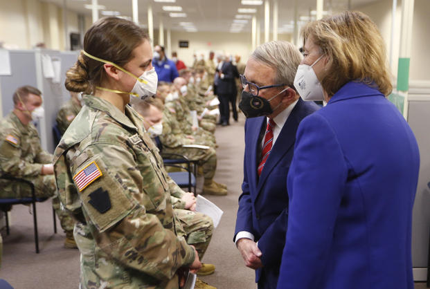 Ohio Gov. Mike DeWine, center, and his wife Fran tour the Defense Supply Center Columbus in Ohio.