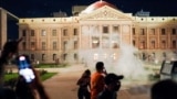 Arizona state troopers deploy tear gas as they confront abortion rights protesters during a protest at the Arizona Capitol, following the U.S. Supreme Court ruling to overturn abortion rights established under Roe v. Wade, in Phoenix, Arizona, June 24, 2