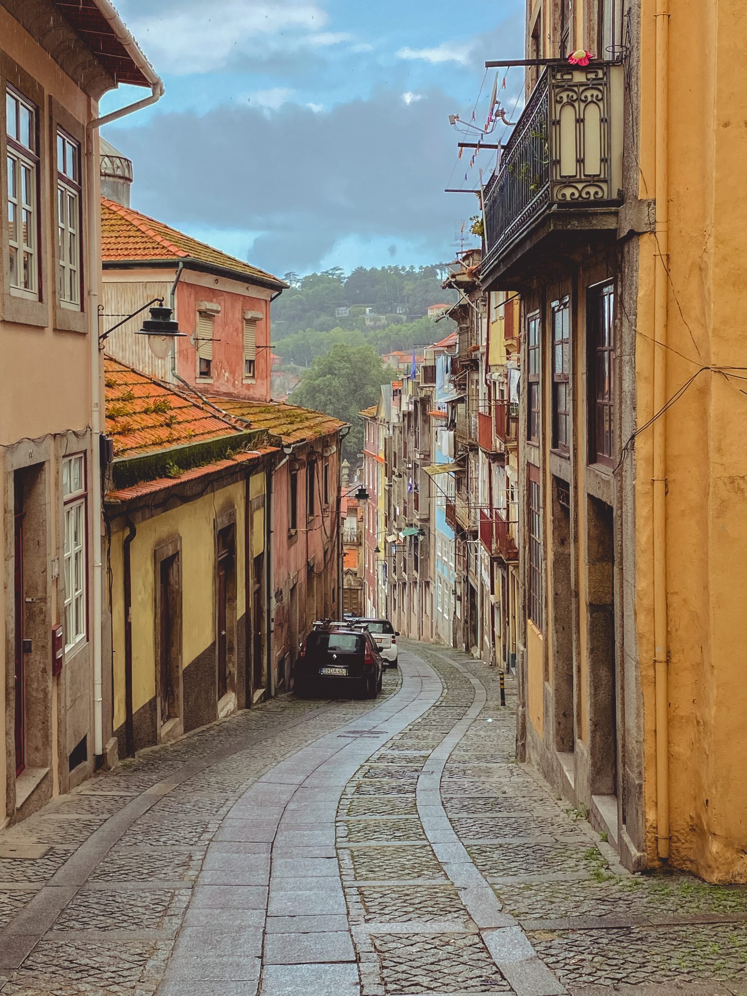 Winding, cobblestone street in Porto, Portugal