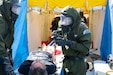 Members of the Utah National Guard Homeland Response Force's decontamination team interact with role players during a mock domestic emergency in support of the Hawaii National Guard’s relief-in-place training exercise at the former Naval Air Station Barbers Point on Oahu, Hawaii, Jan. 28-30, 2020. More than 150 Utah Guard members were transported by military aircraft to Joint Base Pearl Harbor-Hickam to assist and train alongside their Hawaiian counterparts.