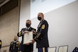 Brig. Gen. Michael Turley, left, adjutant general, Utah National Guard presents Command Sgt.  Maj. Eric Anderson with a citation of merit following Anderson’s retirement after a 31 year career in the Utah National Guard. Anderson served as the senior enlisted leader for the Utah National Guard before announcing his retirement to take place this fall.