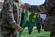 Lt. Col. Budd Vogrinec, commander of the 625th Military Police Battalion and Command Sgt. Maj. Garrett Whatcott unveil the guidon of their new unit during an activation ceremony at the Springville Readiness Center in Springville, Utah, Sept. 13, 2020. The 625th MP Battalion will support the 204th Maneuver Enhancement Brigade, Utah National Guard.