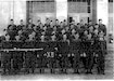 Photo of 1959 National Guard Members at the Fillmore Armory. Note style of windows and doors in the background. (Courtesy photo)