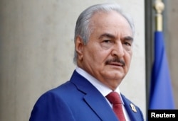 FILE - Khalifa Haftar, the military commander who dominates eastern Libya, arrives to attend an international conference on Libya at the Elysee Palace in Paris on May 29, 2018.