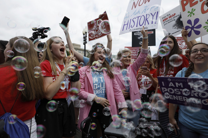 Anti-abortion right activists celebrate after the announcement to the Dobbs v Jackson Women's Health Organization ruling in front of the U.S. Supreme Court on June 24, 2022 in Washington, DC. 