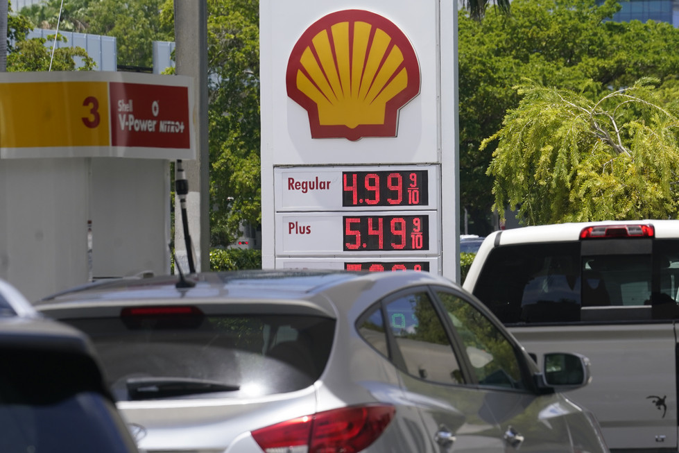 Cars line up at a Shell gas station.