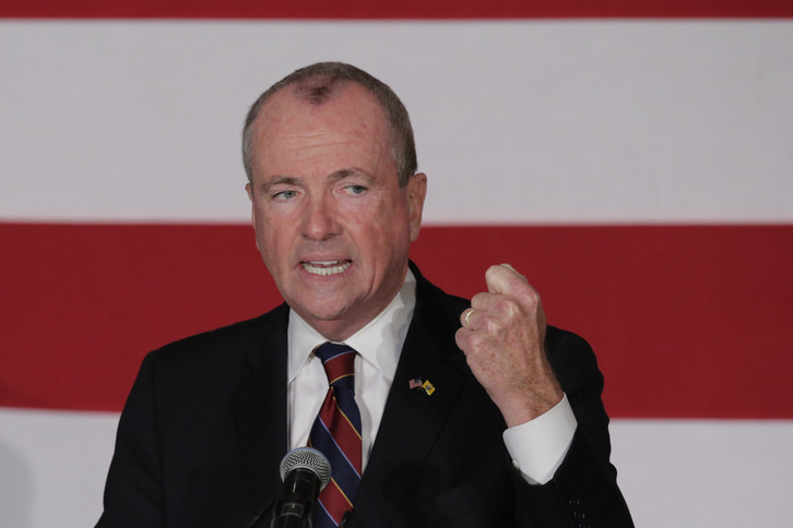 Phil Murphy speaks to attendees during a rally. 