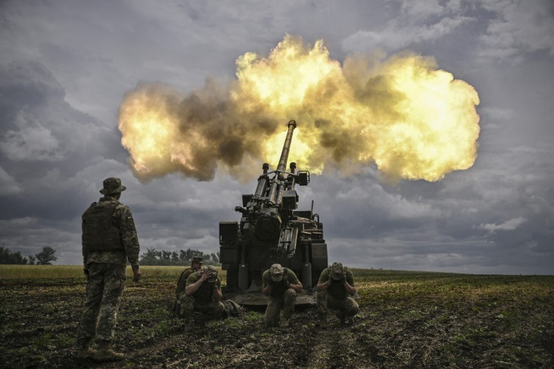 Ukrainian soldiers fire a French CAESAR self-propelled howitzer at Russian positions near the front line in the Donbas region in eastern Ukraine on June 15.