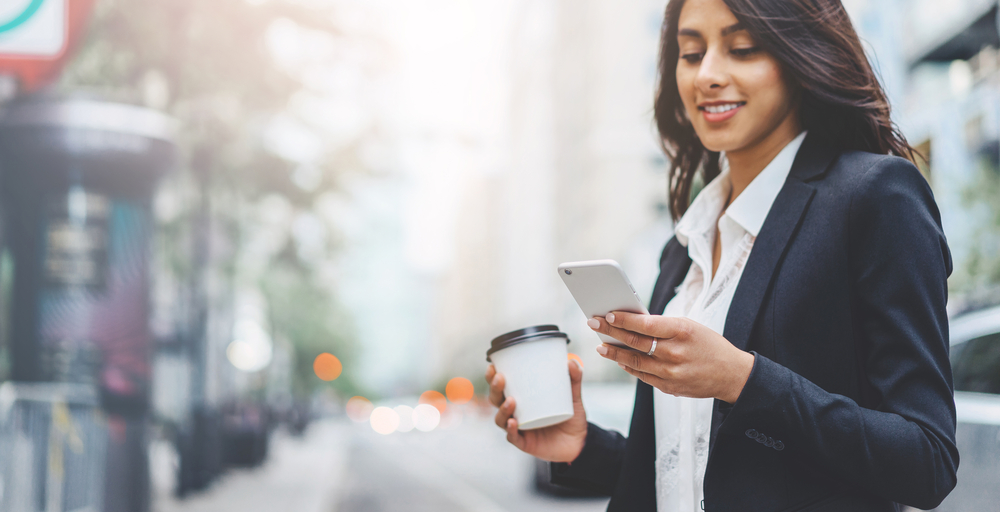 business woman using phone to receive remote support