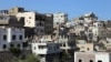 This picture shows traditional buildings damaged during years of fighting, in Yemen's rebel-besieged third city of Taez, on June 9, 2022.