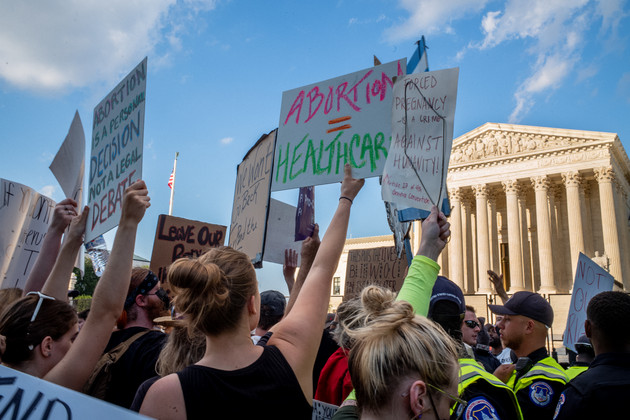 Abortion-rights demonstrators protest in front of the Supreme Court building. 