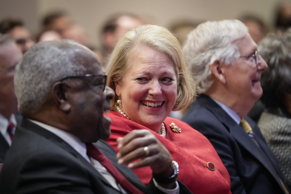 Virginia Thomas while he waits to speak at the Heritage Foundation.