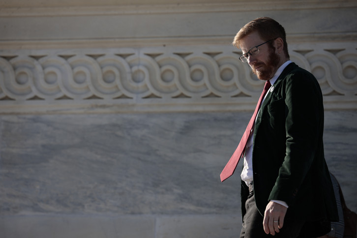 Rep. Peter Meijer walks down the stairs of the U.S. Capitol building.