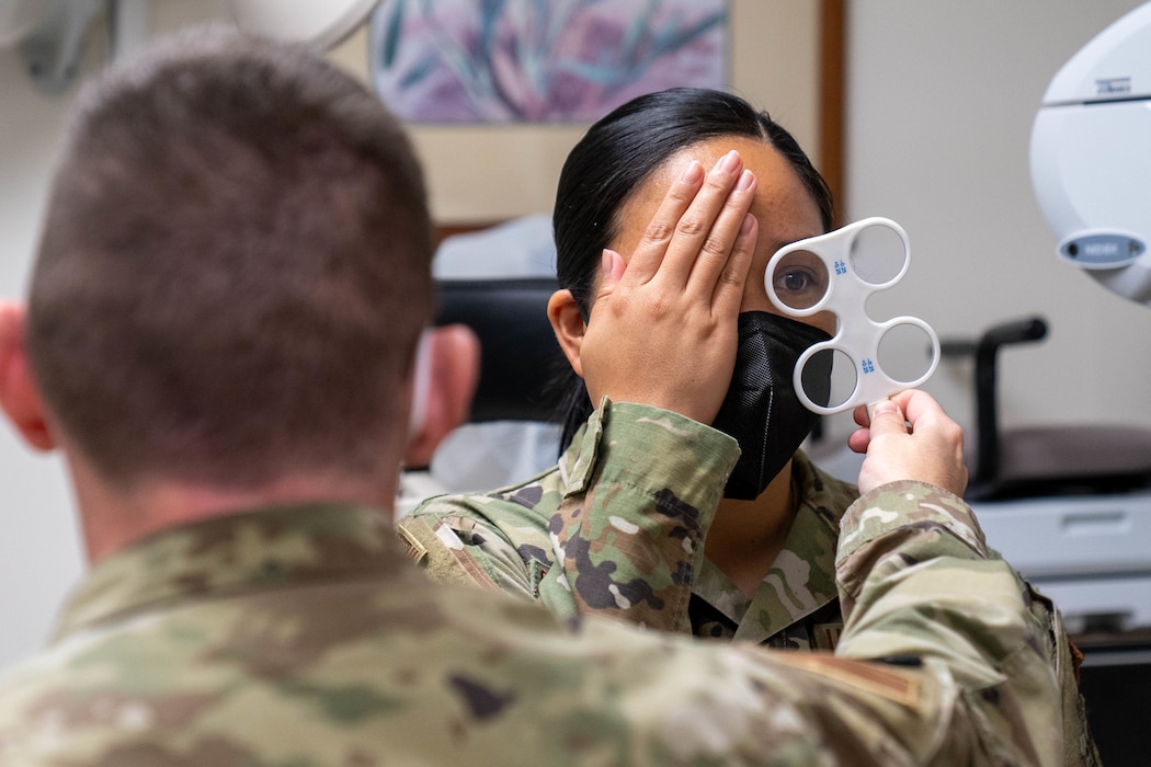 Image of two Airmen in a doctor's office.