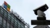 FILE - A security camera is seen near a Microsoft office building in Beijing, China, July 20, 2021. State-backed Russian hackers have engaged in “strategic espionage” against targets in 42 countries backing Ukraine, a new Microsoft report says.