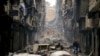 FILE - Residents walk through the destruction of the once rebel-held Salaheddine neighborhood in the eastern Aleppo, Syria, Jan. 20, 2017. The United Nations said the first 10 years of Syria's conflict, which began in 2011, killed more than 300,000 civilians. 