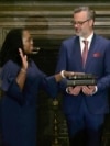 In this image from video provided by the Supreme Court, Chief Justice of the United States John Roberts administers the Constitutional Oath to Ketanji Brown Jackson as her husband Patrick Jackson holds the Bible at the Supreme Court in Washington, June 30, 2022.