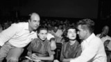 FILE - In this Sept. 23, 1955, file photo, J.W. Milam, left, his wife, second from left, Roy Bryant, far right, and his wife, Carolyn Bryant, sit together in a courtroom in Sumner, Miss.