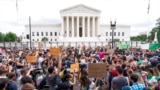 FILE - Demonstrators gather outside the Supreme Court in Washington, June 24, 2022. The Supreme Court has ended constitutional protections for abortion that had been in place nearly 50 years.