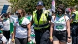 Abortion-rights activists demonstrating against the Supreme Court decision to overturn Roe v. Wade, submit themselves to arrest by Capitol Police after blocking a street on Capitol Hill in Washington, Thursday, June 30, 2022. 