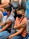 Children under the age of 11 wait after receiving a dose of the Pfizer-BioNTech vaccine against COVID-19, in Mexico City, on June 27, 2022.