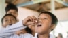 A student takes a dose of medication for lymphatic filariasis during a mass drug administration campaign in South Sumatra, Indonesia. (File)