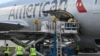 Airport employees unload a batch of 1.5 millon dosis of Moderna vaccine donated by the US which arrived to the Aurora International Airport in Guatemala City. (File)