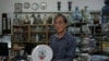 Joseph Tso, owner of Yuet Tung China Works, Hong Kong's last hand-painted porcelain factory, holds a plate with UK royal print in Hong Kong, June 8, 2022. Tso is the third-generation owner of the factory.