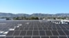 Solar panels are seen on the roof of a building in Los Angeles, California, on June 18 2022.