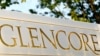 FILE - The logo of commodities trader Glencore is pictured in front of the company's headquarters in Baar, Switzerland, July 18, 2017. 