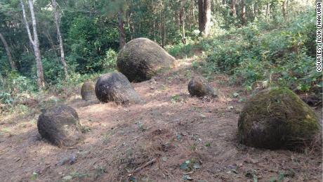 About 65 stone jars were discovered partially unearthed in northeastern India.