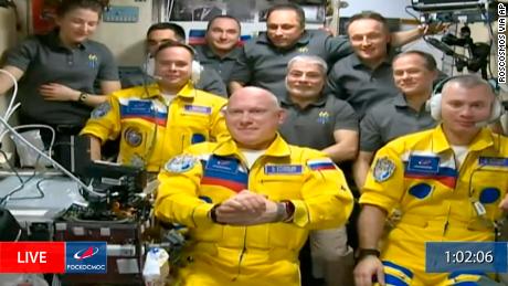 In this frame grab from video provided by Roscosmos, Russian cosmonauts Sergey Korsakov, Oleg Artemyev and Denis Matveyev are seen during a welcome ceremony after arriving at the International Space Station, Friday, March 18, 2022, the first new faces in space since the start of Russia&#39;s war in Ukraine. The crew emerged from the Soyuz capsule wearing yellow flight suits with blue stripes, the colors of the Ukrainian flag. (Roscosmos via AP)