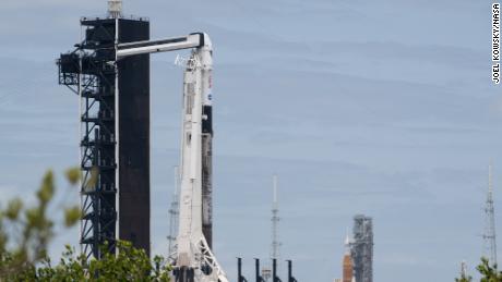 NASA&#39;s Space Launch System (SLS) rocket with the Orion spacecraft aboard is seen atop a mobile launcher at Launch Complex 39B, right, as A SpaceX Falcon 9 rocket with the company&#39;s Crew Dragon spacecraft onboard is seen on the launch pad at Launch Complex 39A as preparations continue for the Crew-4 mission, Wednesday, April 20, 2022, at NASA&#39;s Kennedy Space Center in Florida. 