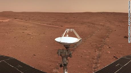 Zhurong rover looking back at the lander. A view of landing area, the wheel tracks, and a small sand dune. CREDIT China National Space Administration