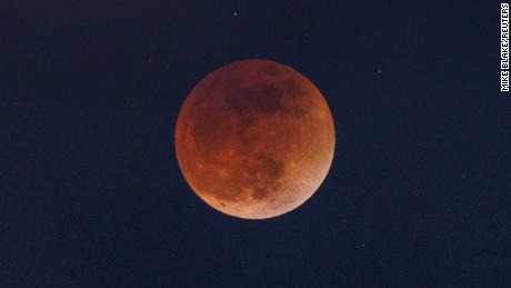 Clouds roll in as a full moon moves through the shadow of the earth during a &quot;Blood Moon&quot; lunar eclipse in San Diego, California, U.S., May 16, 2022. REUTERS/Mike Blake